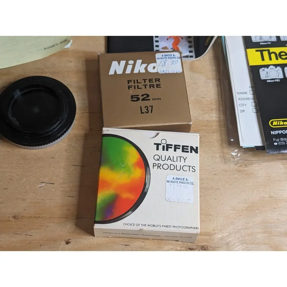 Nikon EM Black body 50mm Series E + Auto Tele Converter + Bag + Kalimar Light +